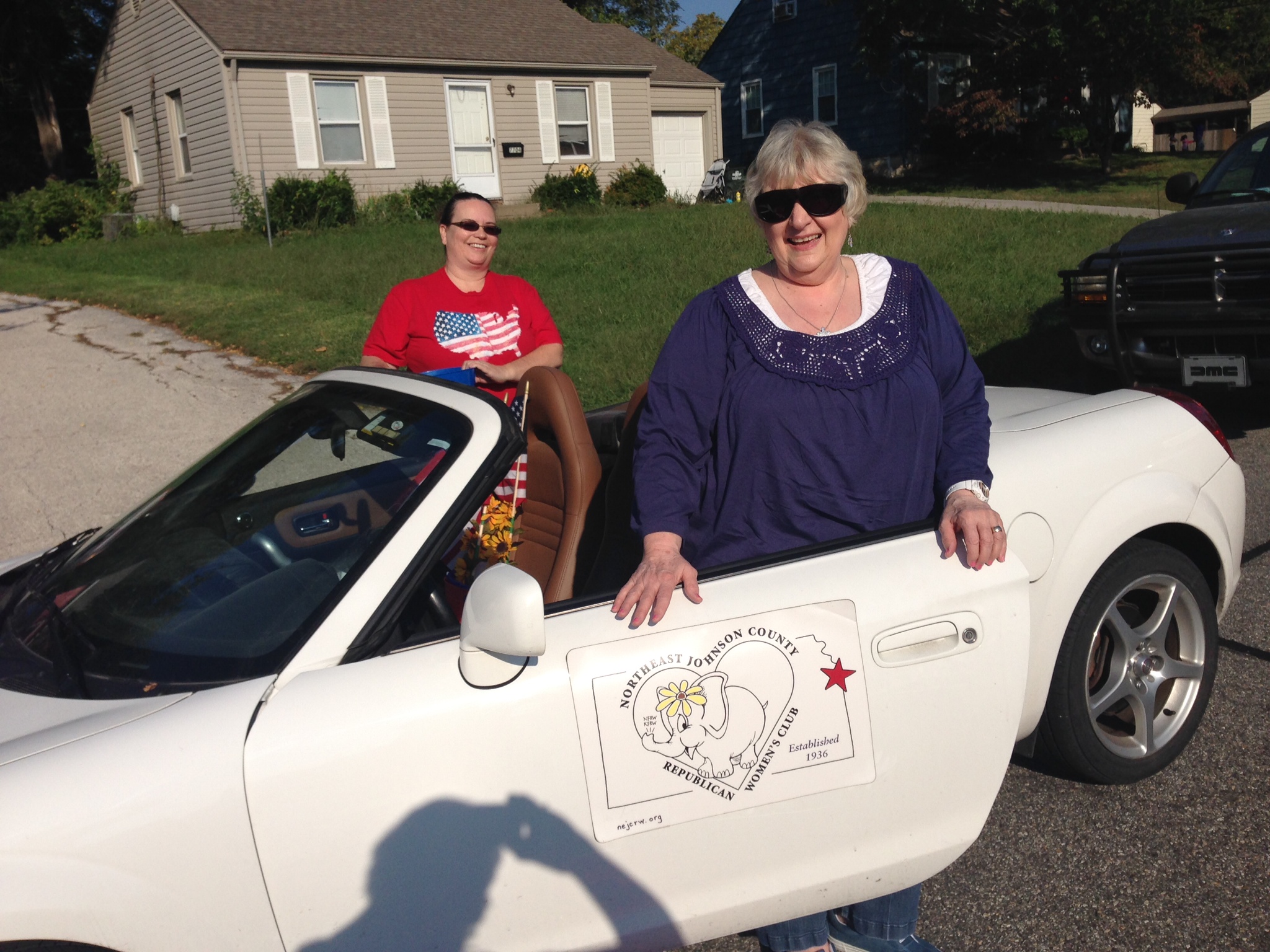 Our 2014 Overland Park Parade NEJCRW Club-mobile and crew.  Teree Nicholas and Erin Metters.